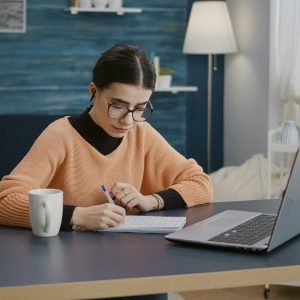 Student attending online tutoring session, tutor teaching via Zoom, online learning environment