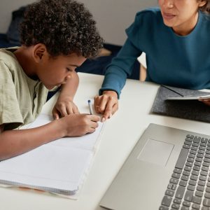 Tutor helping boy with school subject So, what age is best to get a tutor?